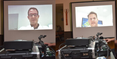 Die Redner in aktion auf der Leinwand